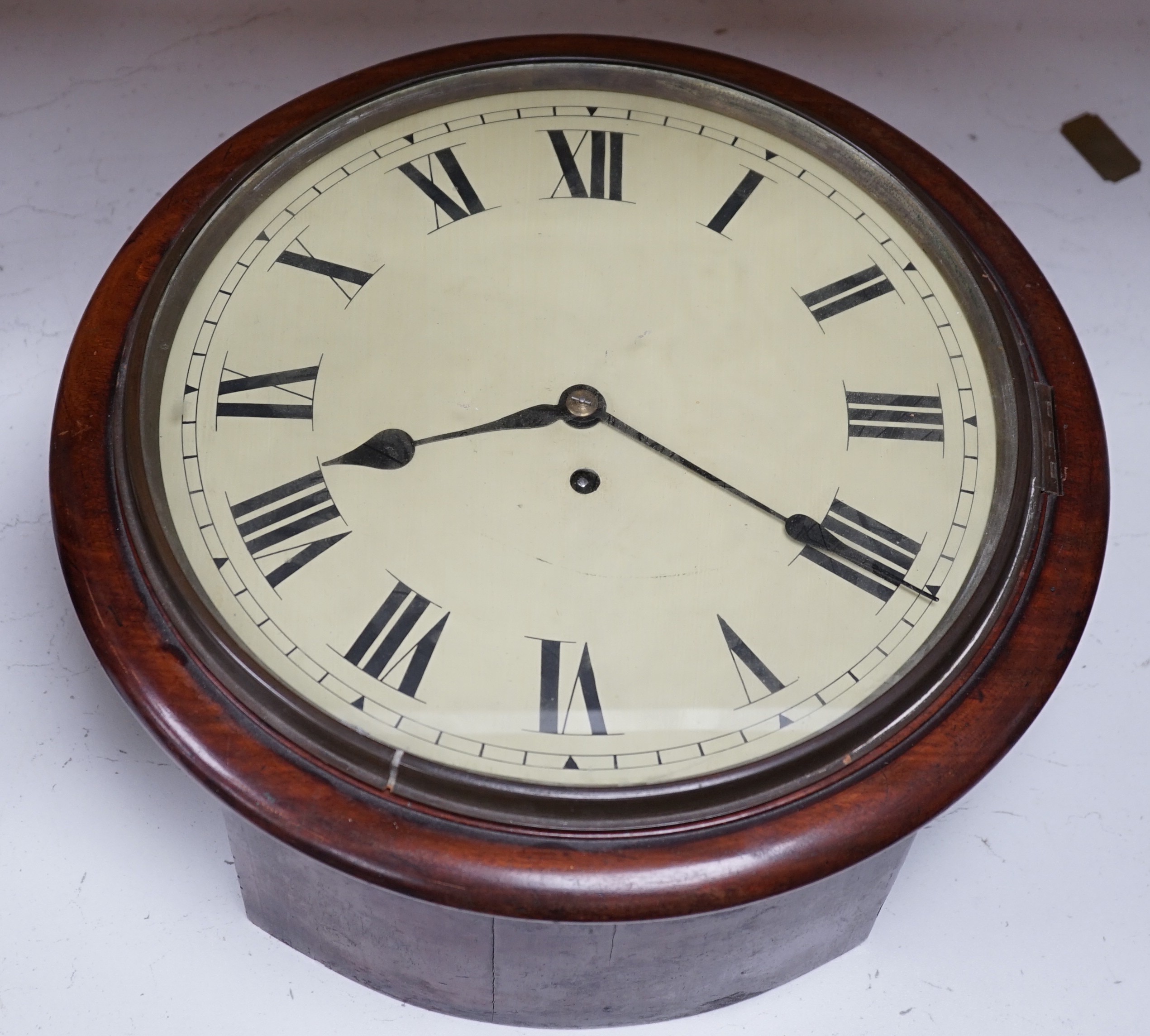 A Victorian mahogany dial timepiece, with pendulum. 36.5cm diameter